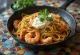 Fideuà con allioli servita con frutti di mare e allioli