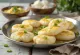 Idli servito con olio d'oliva speziato
