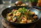 Bicol Express ai frutti di mare, servito con coriandolo fresco e riso come contorno