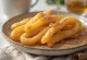 Churros al miele, churros dorati serviti con salsa al miele